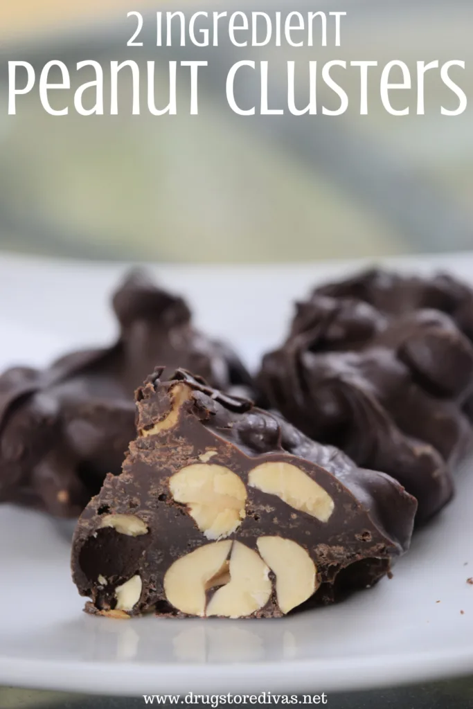 Three peanut clusters on a plate, with one cut in half, and the words "2 Ingredients Peanut Clusters" digitally written on top.