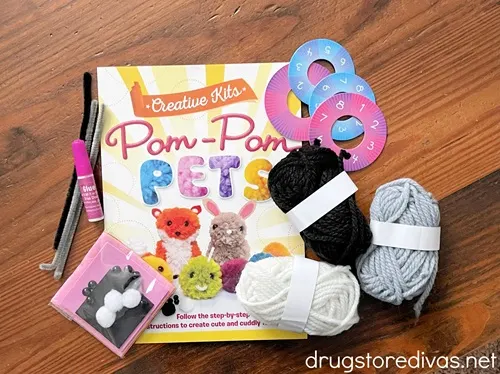 A Pom Pom Pets kit with all the supplies taken out of the box.