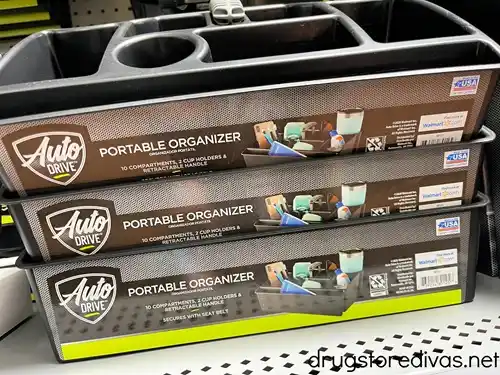 Three portable organizers for the car stacked on a shelf in a store.