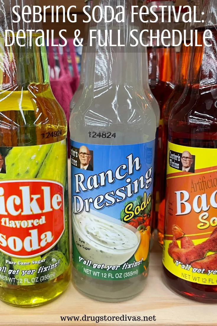 Three bottles of soda (one pickle, one ranch, and one bacon) on a shelf with the words 