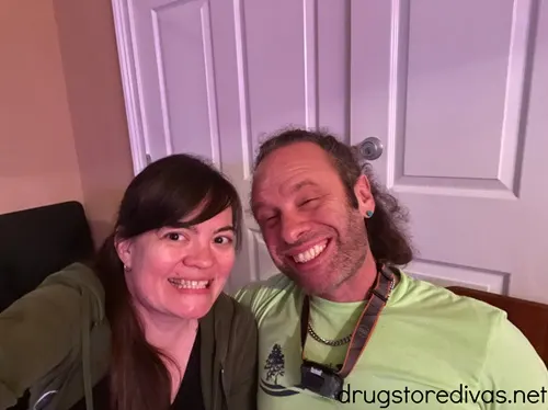A man and a woman wearing green.
