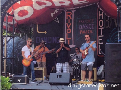 Five musicians on stage at the Cape Fear Blues Fest in Wilmington, NC.