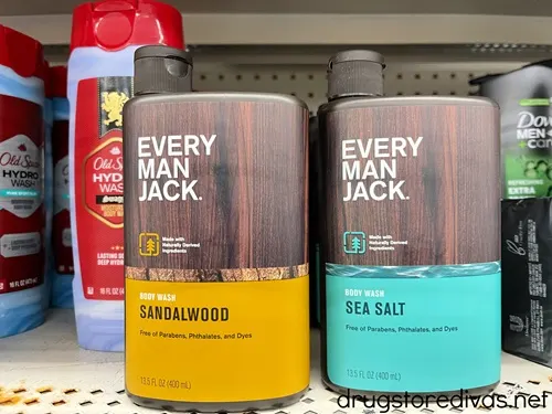 Two bottles of Every Man Jack body wash on a shelf.