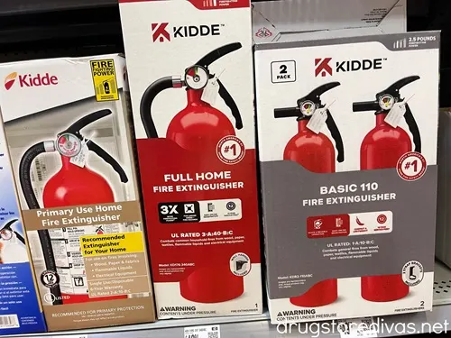 If you're headed to a housewarming party, pick up something off this 10+ Housewarming Gift Ideas post from www.drugstoredivas.net. Three boxes of fire extinguishers on a shelf in a store.