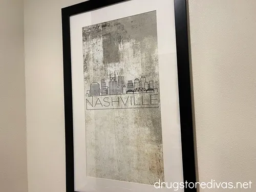 Framed wall art of the Nashville skyline.