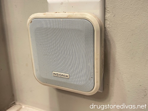A square Bluetooth speaker plugged into the wall.