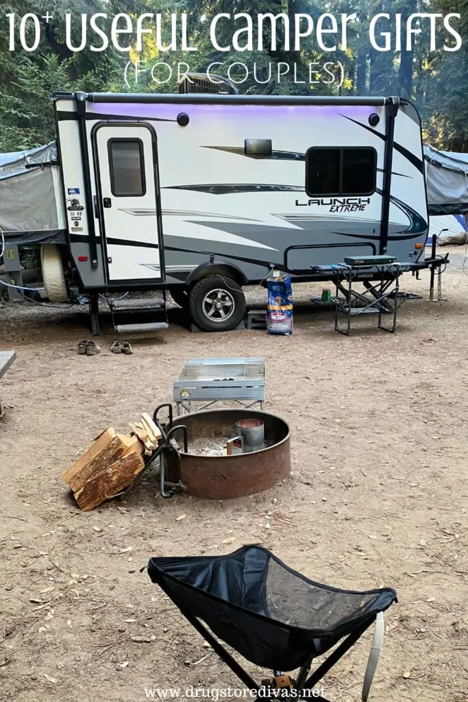 An RV camper on a campsite with a chair and firepit in front of it and the words "10+ Useful Camper Gifts (for couples)" digitally written on top.