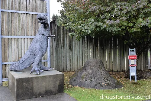 A bronze t-rex statue at Cougar Mountain Zoo in Issaquah, Washington.