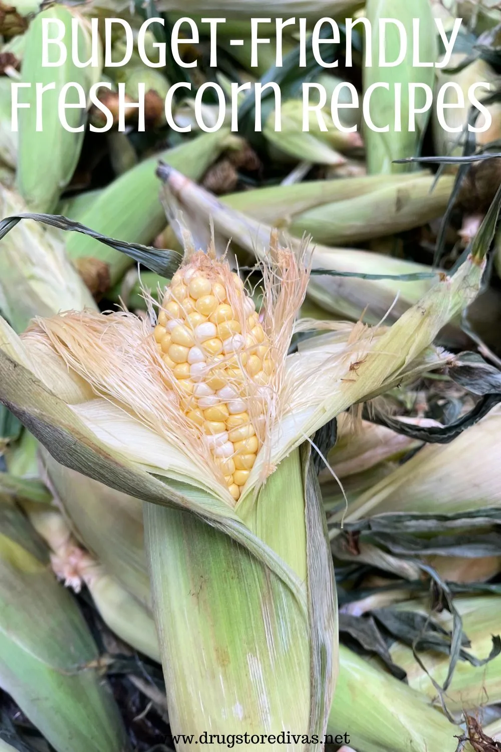 A partially shucked ear of corn with the words 