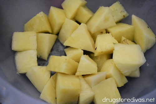 Pineapple cut into chunks in a bowl.