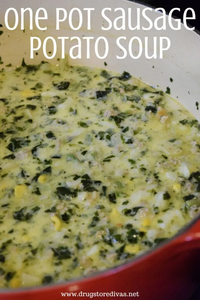 A soup with spinach and potatoes and the words "One Pot Sausage Potato Soup" digitally written on top.