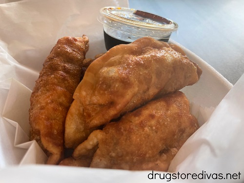 Fried gyoza and sauce in a to go container from Fusion Express in Abbeville, SC.