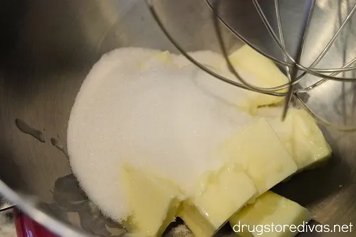 Sugar and butter in a stand mixer bowl.