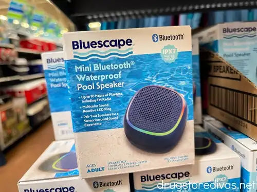 A stack of waterproof bluetooth speakers in boxes in a store.