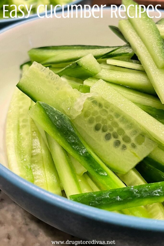 A bowl filled with cucumber slices and the words "Easy Cucumber Recipes" digitally written up top.