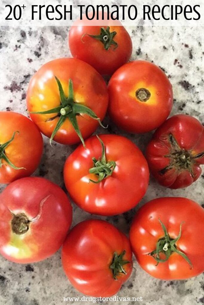 A pile of garden tomatoes with the words "20+ Fresh Tomato Recipes" digitally written on top.
