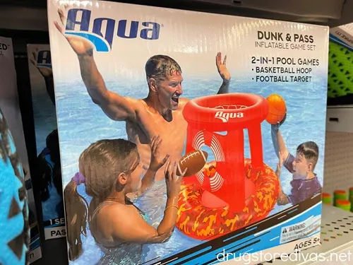 An inflatable basketball hoop for the pool in a box on a shelf in the store.