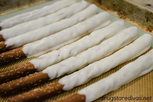Pretzel rods covered in white chocolate.