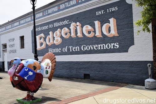 A painted turkey in front of a mural in Edgefield, SC.