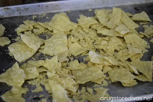Tortilla chips on a baking sheet.