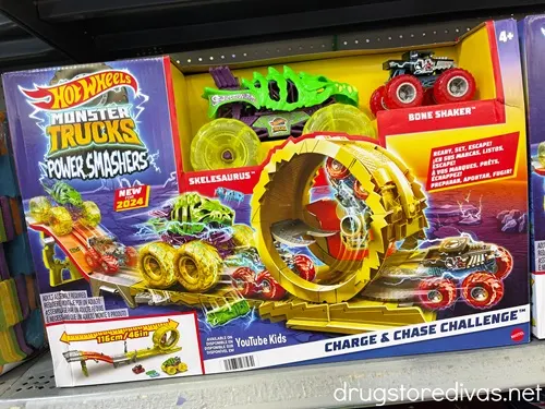 A Hot Wheels Monster Trucks Power Smashers Charge & Chase Challenge set on a shelf.