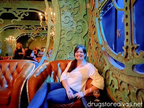 A woman sitting at the submarine bar in Lost Spirits Las Vegas.