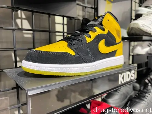 A yellow and black pair of Nike sneakers.