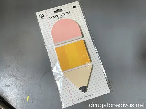 Sticky note pads that are shaped like a pencil.
