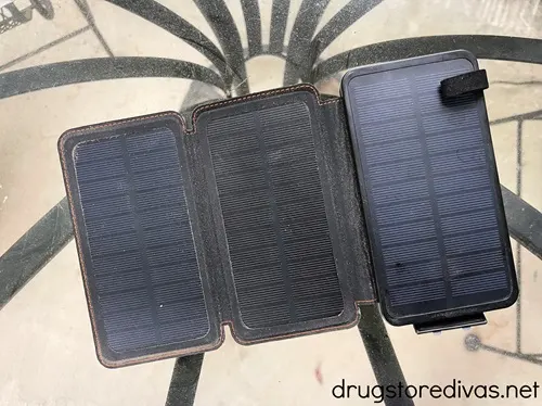 A solar charger on a glass table.