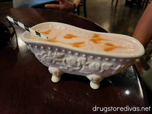 A cocktail in a bathtub-shaped mug.