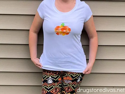 A woman wearing a homemade pumpkin shirt.
