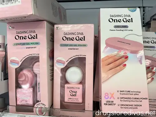 Two boxes of gel nail polish and a gel nail kit on a shelf in a store.