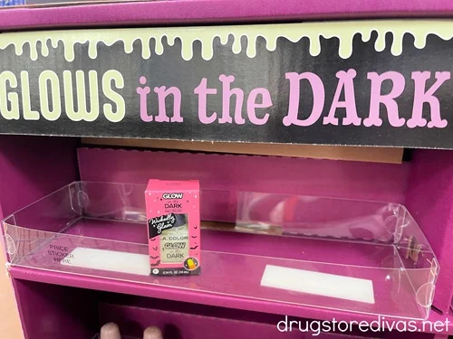 A box of glow in the dark nail polish on a shelf in the store.