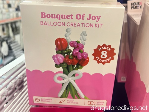 A package for a balloon kit to make a bouquet of flowers on a peg at a store.