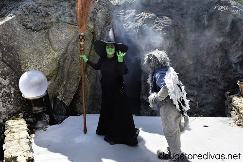 The Wicked Witch and a flying monkey from the Wizard of Oz at the Land of Oz theme park.