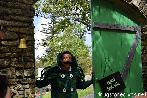 The Gate Keeper from the Wizard of Oz at a gate at the Land of Oz theme park.