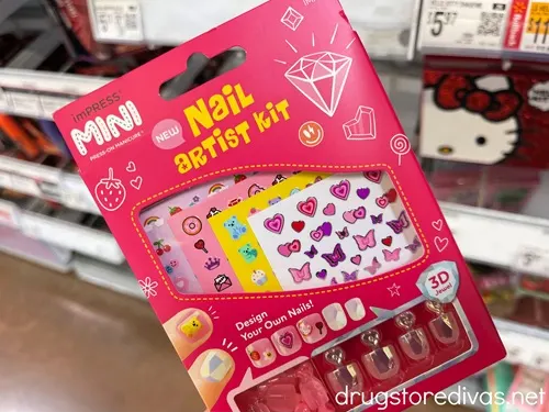 A pink box filled with nail art stickers.