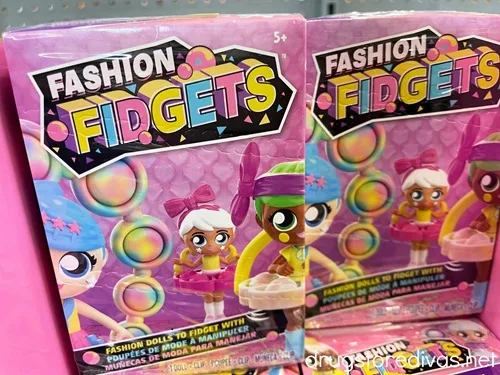 Two boxes of Fashion Fidgets boxes on a shelf.