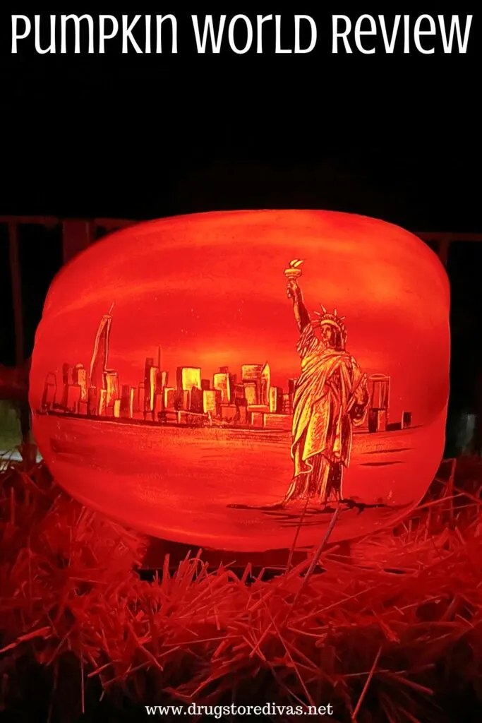 A pumpkin with the New York skyline carved into it with the words "Pumpkin World Review" digitally written on top.