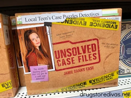 The Unsolved Case Files board game on a shelf.