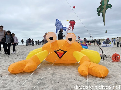 A crab shaped kite on the beach.
