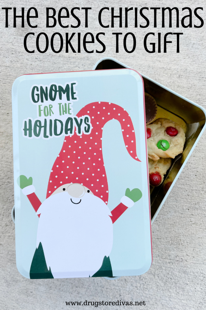 A metal box with a gnome on the front and cookies inside with the words "The Best Christmas Cookies To Gift" digitally written up top.