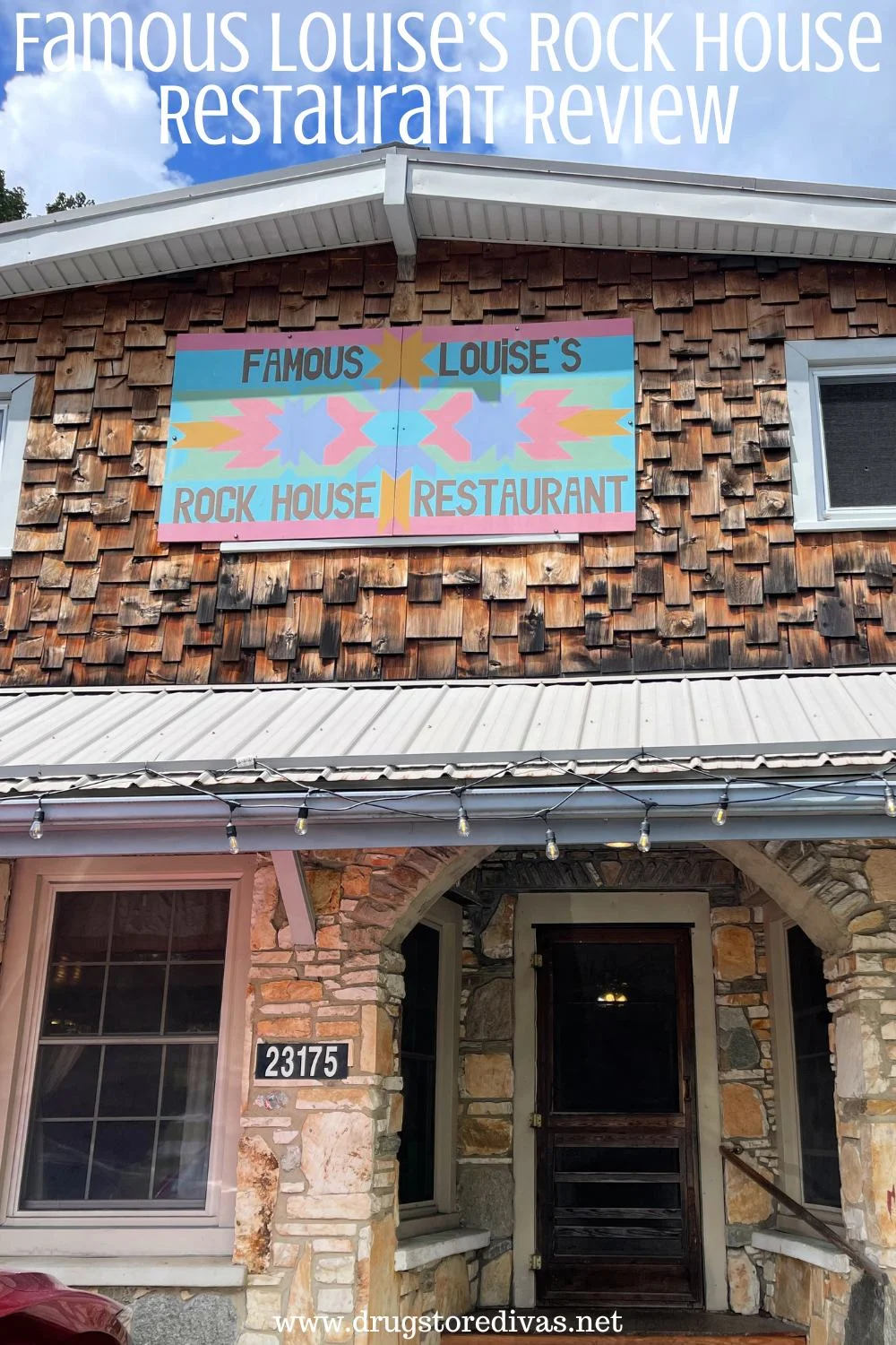 The outside of a rock building with the words 