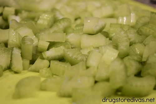Cut celery pieces on a cutting board.