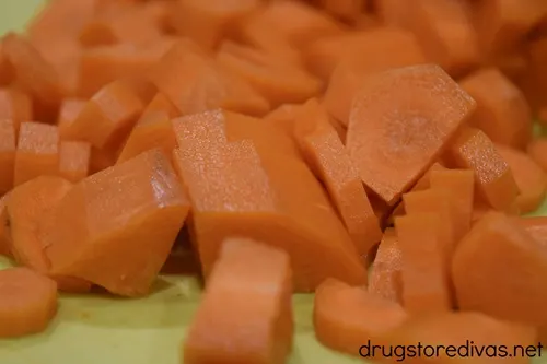 Cut carrot pieces on a cutting board.