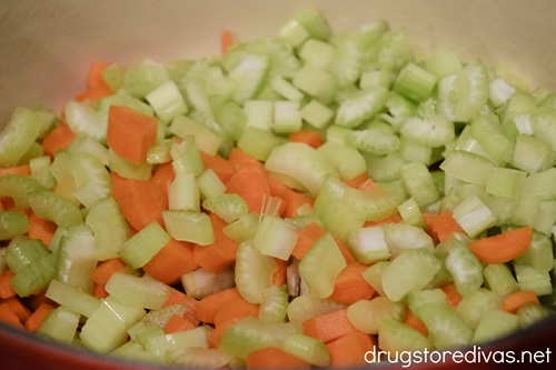Chopped celery and carrots in a Dutch oven.