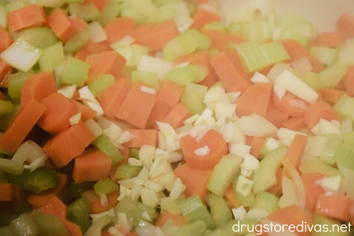 Chopped celery, carrots, onion, and garlic in a Dutch oven.