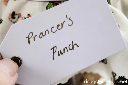 A white gift tag with the words "Prancer's Punch" on it.