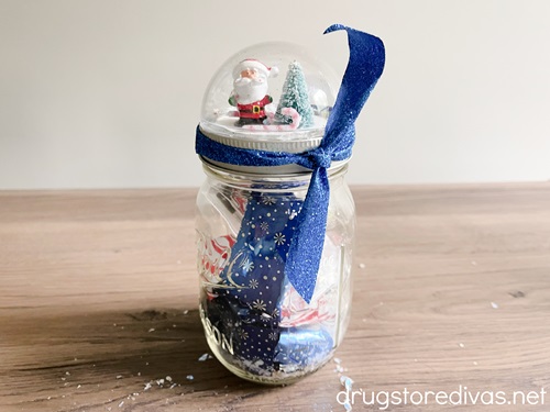 A DIY Snow Globe Mason Jar Topper and candy holder.