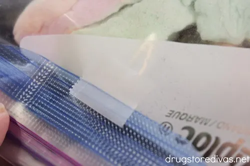 The edge of a plastic bag folded down and taped.